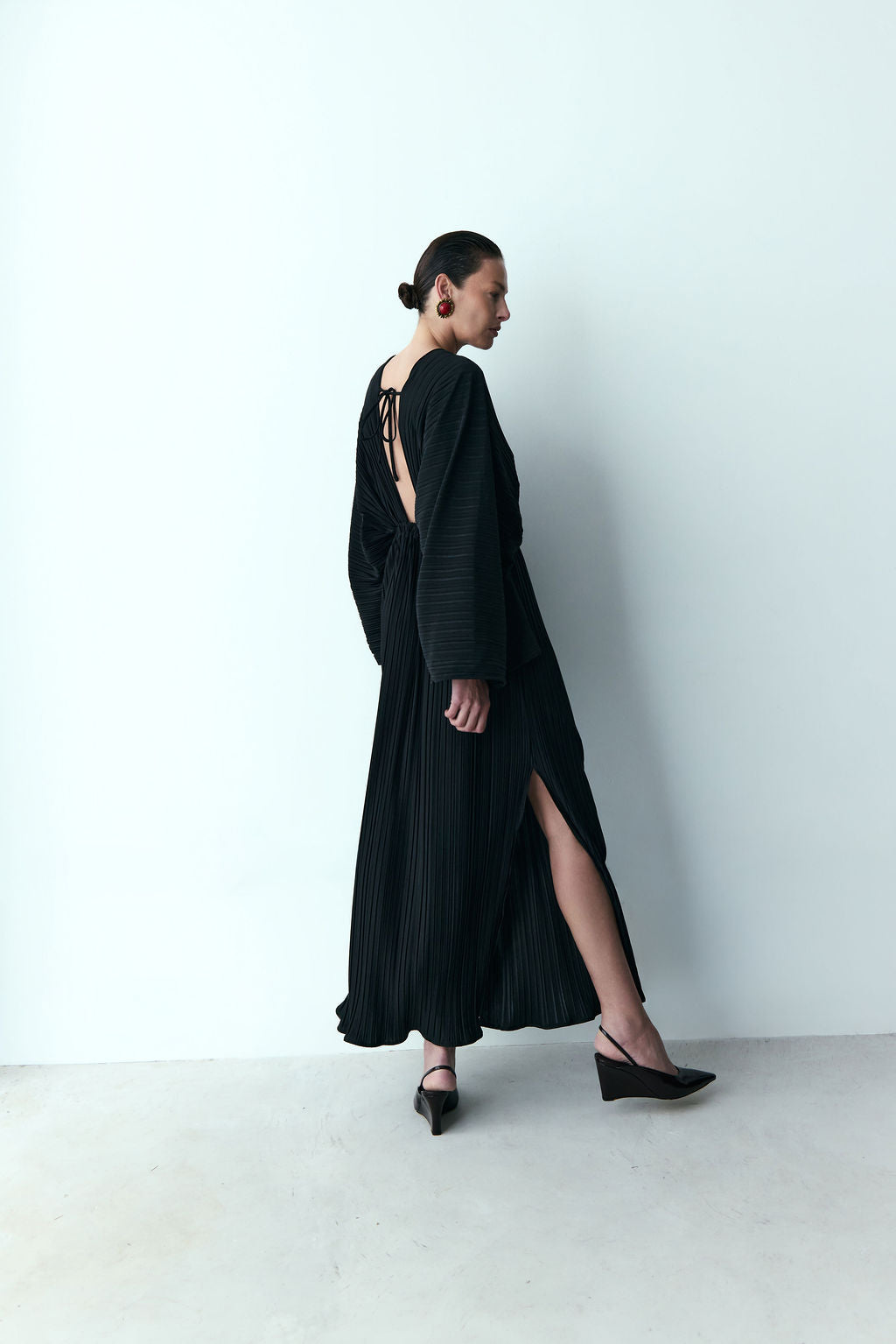 black pleated dress with sleeves